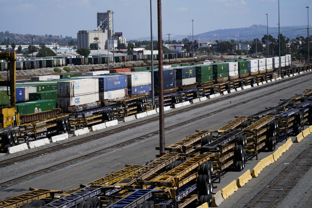 Freight train cars sit in a Union Pacific rail yard